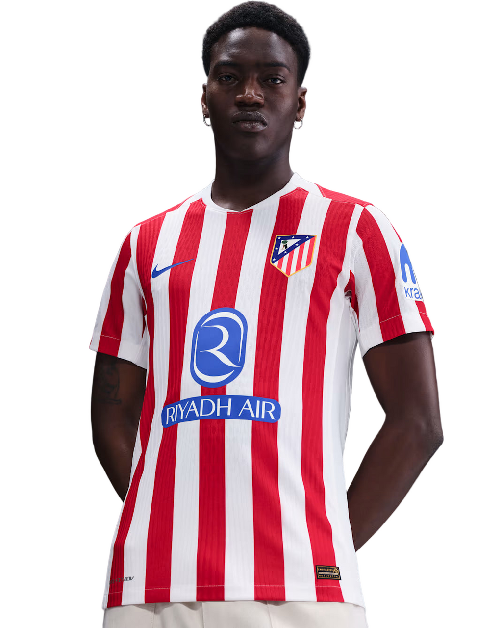 Person wearing a red and white striped sports jersey with visible branding on a gray background