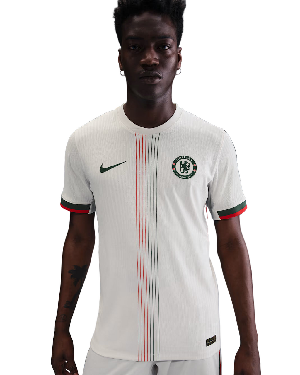 Person wearing a white sports jersey with red and green accents on a gradient background