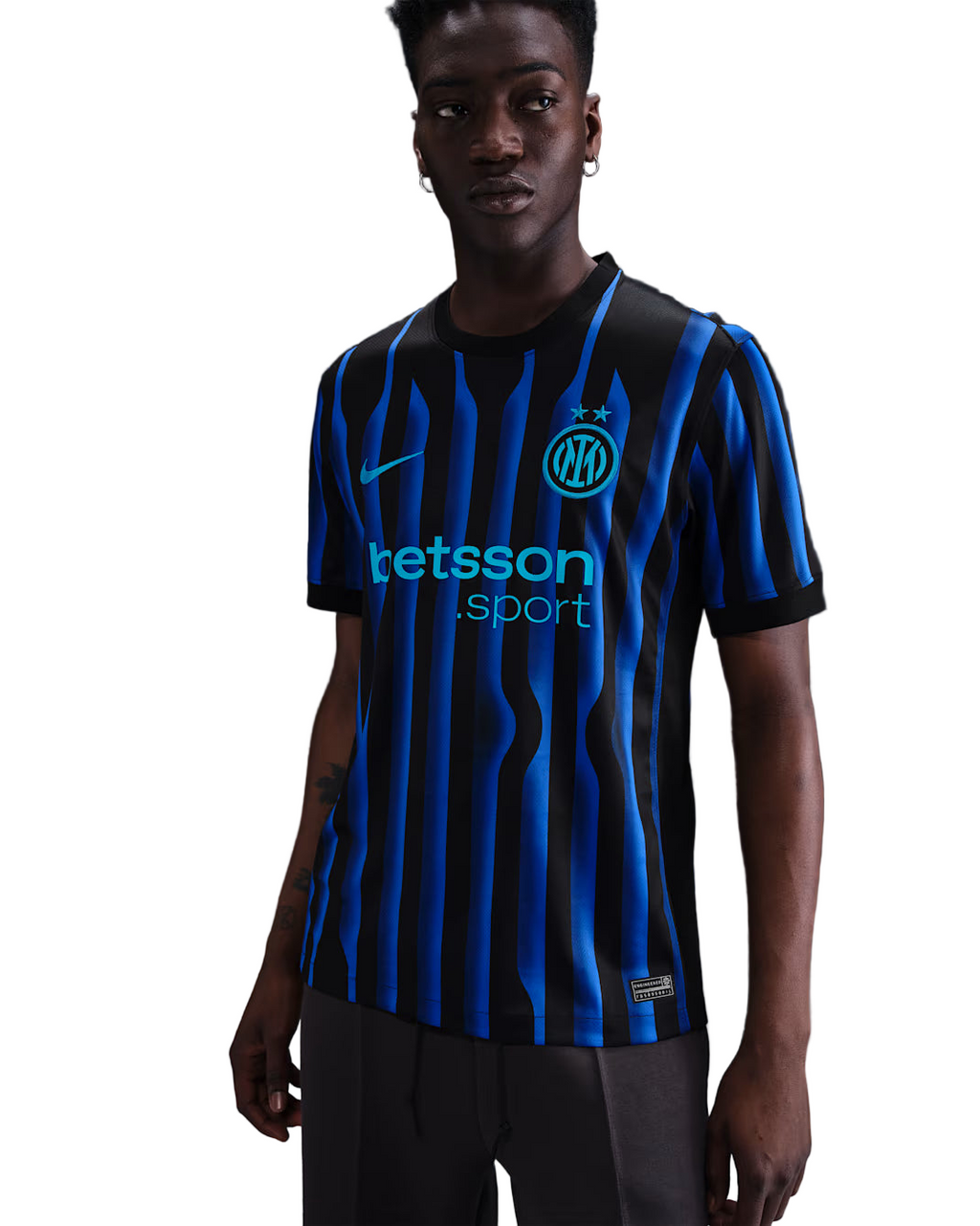 Person wearing a blue and black striped sports jersey with visible branding on a dark background