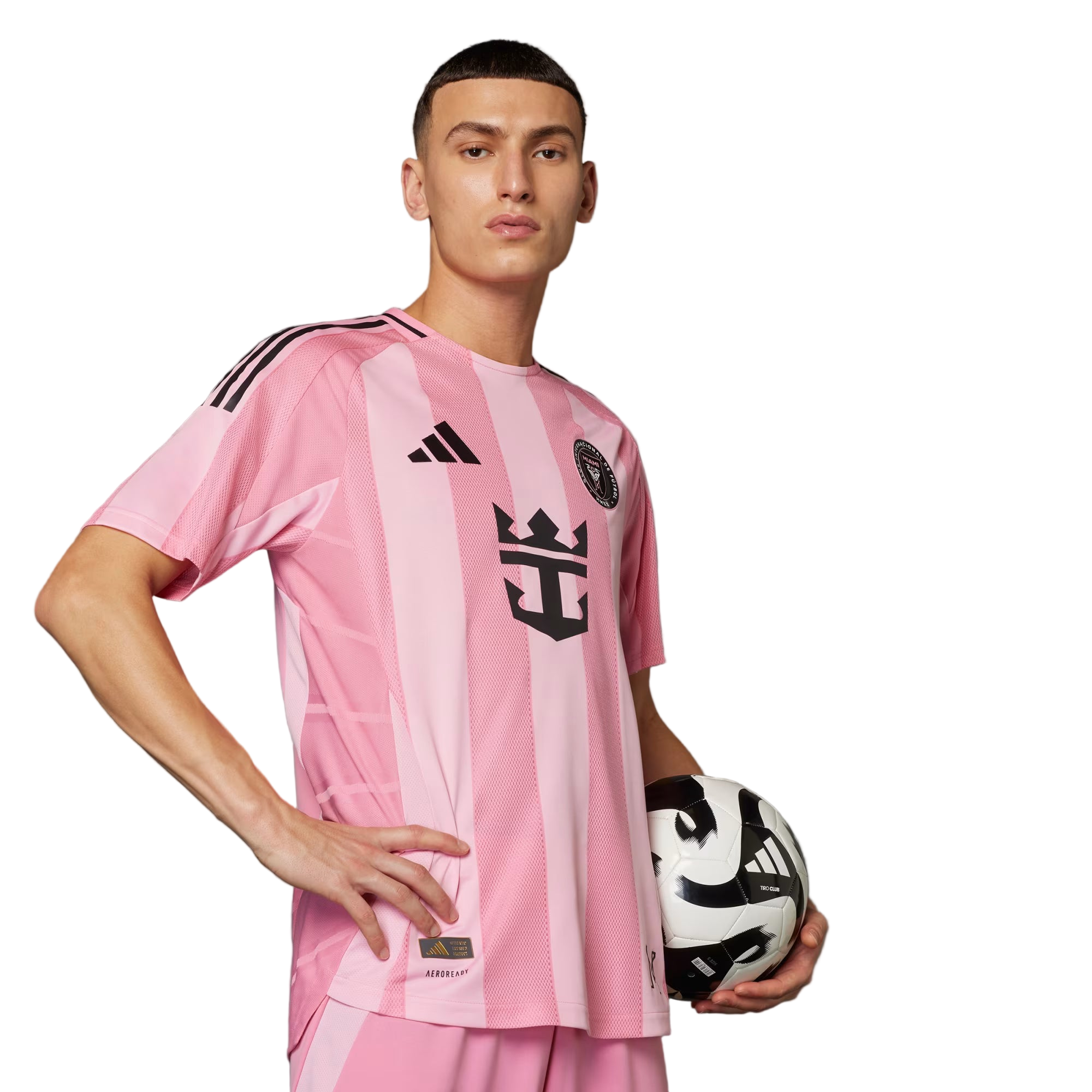 Person wearing a pink and white striped soccer jersey holding a soccer ball on a gray background