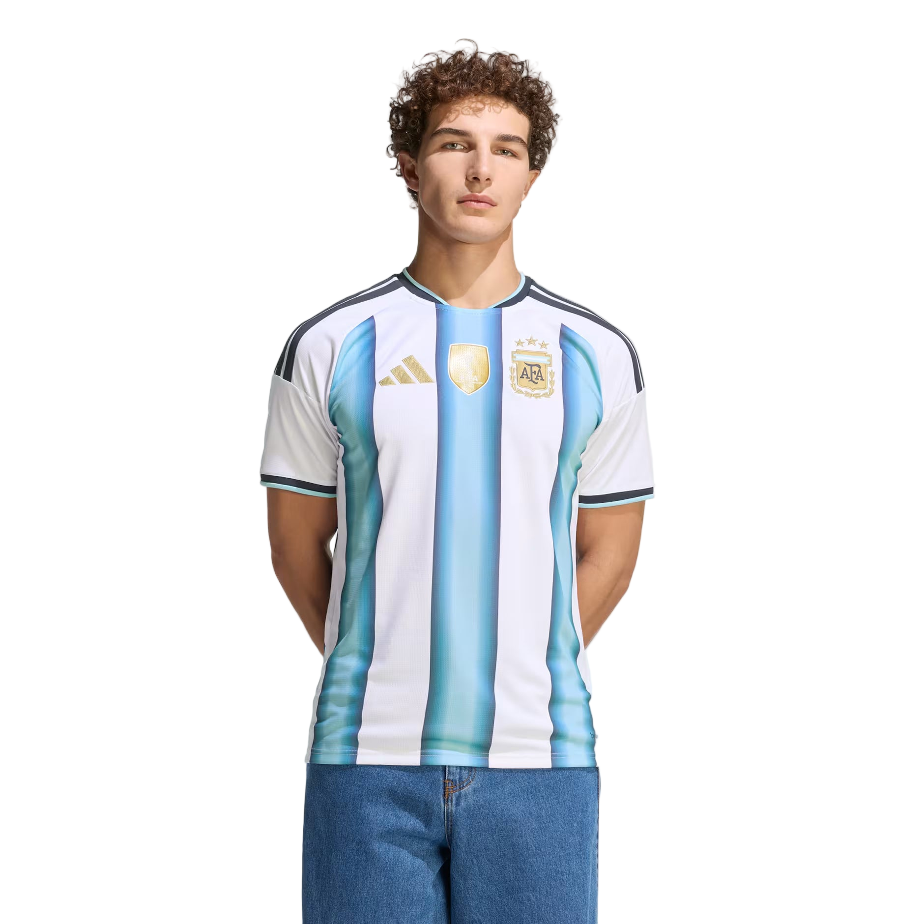 Person wearing an Argentina soccer jersey with Adidas logo on a white background