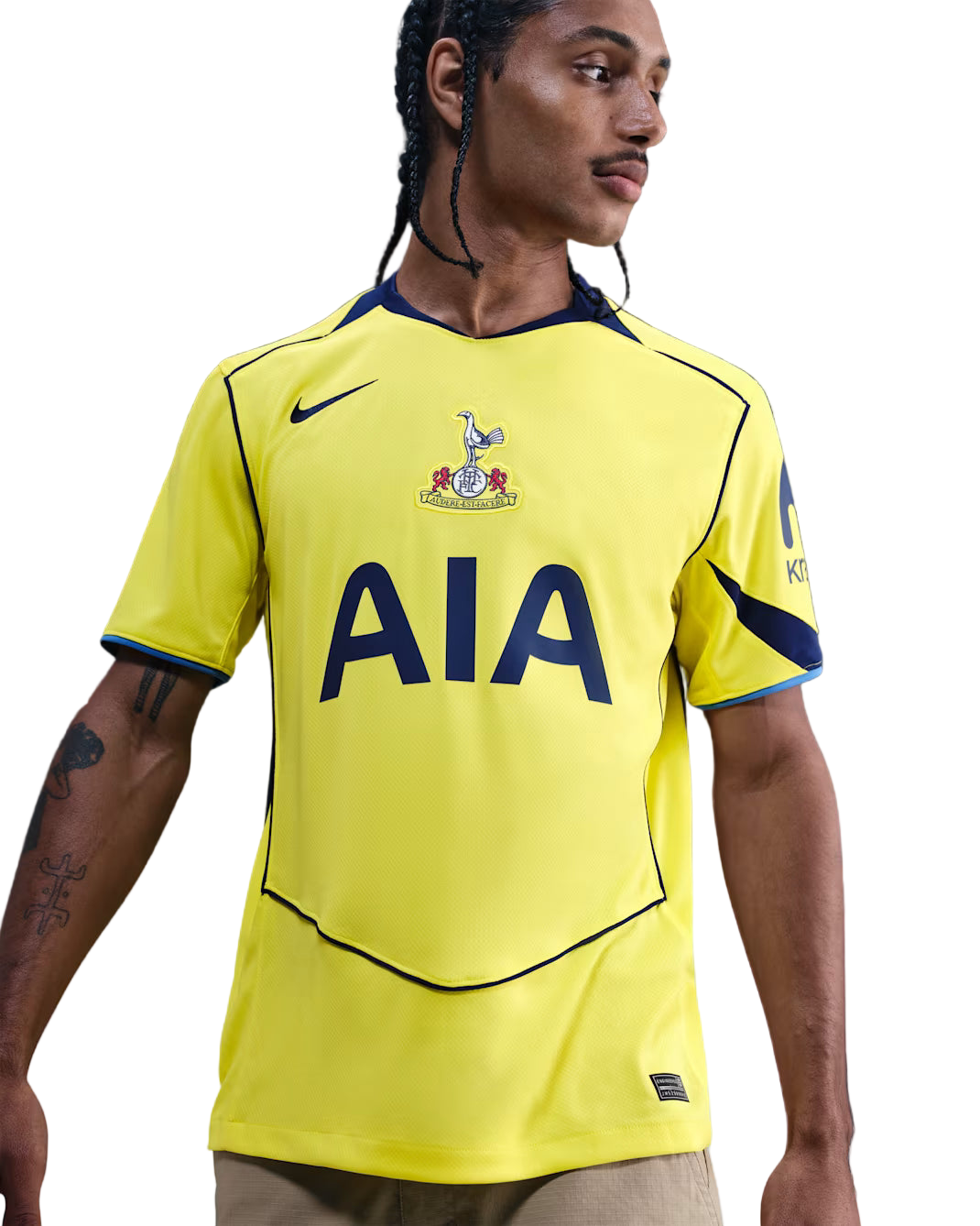 Person wearing a yellow sports jersey with branding on a gradient background